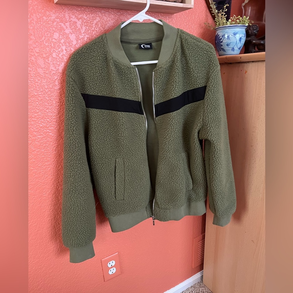 Zyia Cozy fleece bomber with pockets and a zipper closure.